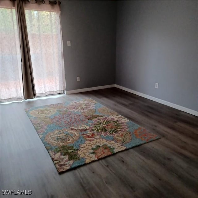 2925 Winkler Ave Unit 906, Fort Myers, FL 33916 - spare room with wood finished floors and baseboards