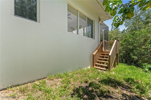 1923 Sheffield Ave, Marco Island, FL 34145 - view of property exterior featuring stucco siding and stairway