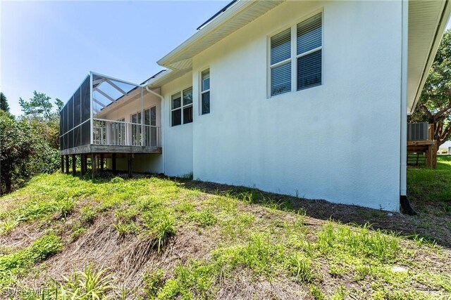 1923 Sheffield Ave, Marco Island, FL 34145 - view of home's exterior with a lanai and stucco siding