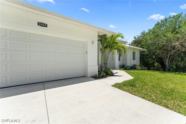 1923 Sheffield Ave, Marco Island, FL 34145 - view of front of property with driveway and a front lawn