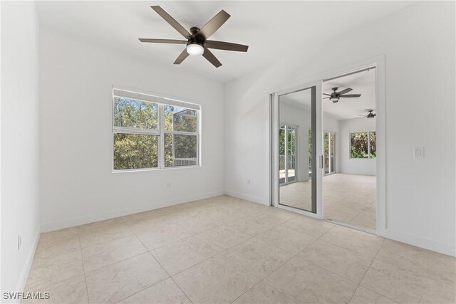 1923 Sheffield Ave, Marco Island, FL 34145 - unfurnished room featuring plenty of natural light, a ceiling fan, and baseboards