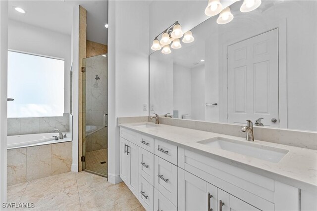 1923 Sheffield Ave, Marco Island, FL 34145 - bathroom featuring a stall shower, double vanity, a bath, a chandelier, and recessed lighting