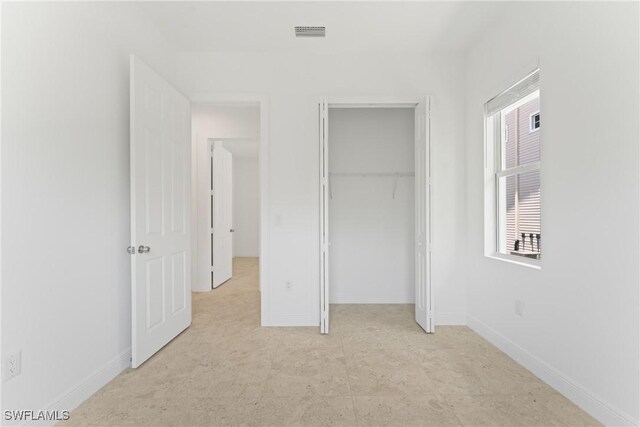 1923 Sheffield Ave, Marco Island, FL 34145 - unfurnished bedroom with a closet and baseboards
