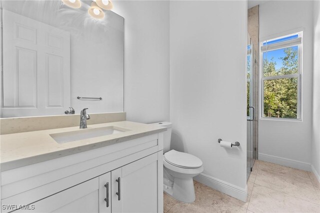 1923 Sheffield Ave, Marco Island, FL 34145 - bathroom featuring vanity, toilet, a shower stall, and baseboards