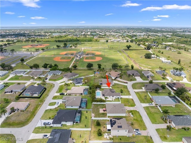 2208 SW 12th Ln, Cape Coral, FL 33991 - aerial view of property and surrounding area featuring nearby suburban area