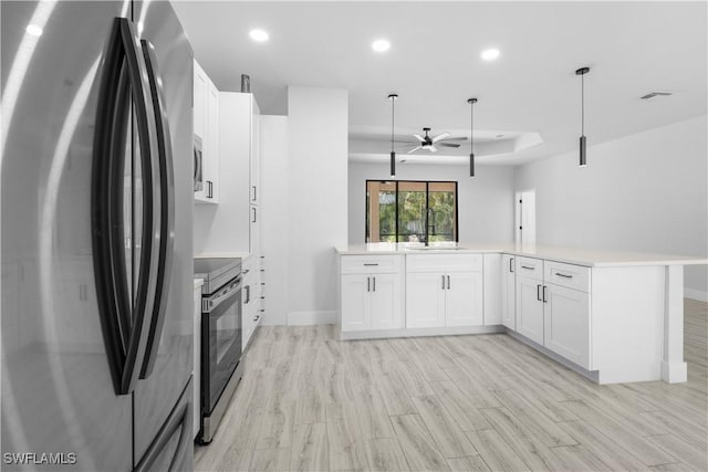 2208 SW 12th Ln, Cape Coral, FL 33991 - kitchen with appliances with stainless steel finishes, a sink, ceiling fan, recessed lighting, and light countertops