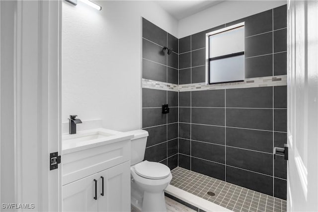 2208 SW 12th Ln, Cape Coral, FL 33991 - full bath featuring tiled shower, vanity, and toilet