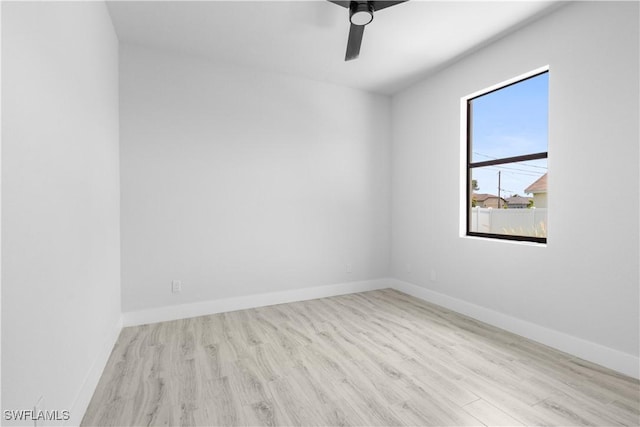 2208 SW 12th Ln, Cape Coral, FL 33991 - spare room featuring wood finished floors, ceiling fan, and baseboards