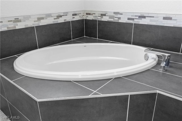 2208 SW 12th Ln, Cape Coral, FL 33991 - bathroom featuring a garden tub