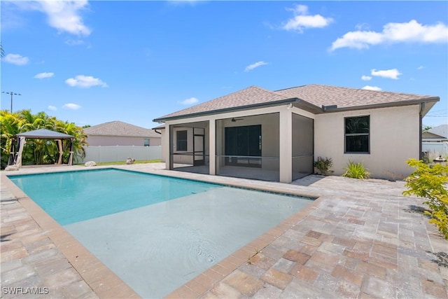 2208 SW 12th Ln, Cape Coral, FL 33991 - back of house with a gazebo, a sunroom, stucco siding, a ceiling fan, and a patio