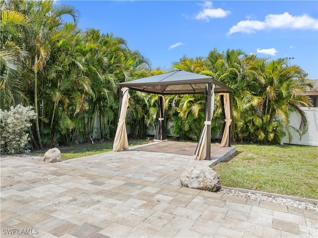 2208 SW 12th Ln, Cape Coral, FL 33991 - view of patio / terrace featuring a gazebo, driveway, and a carport