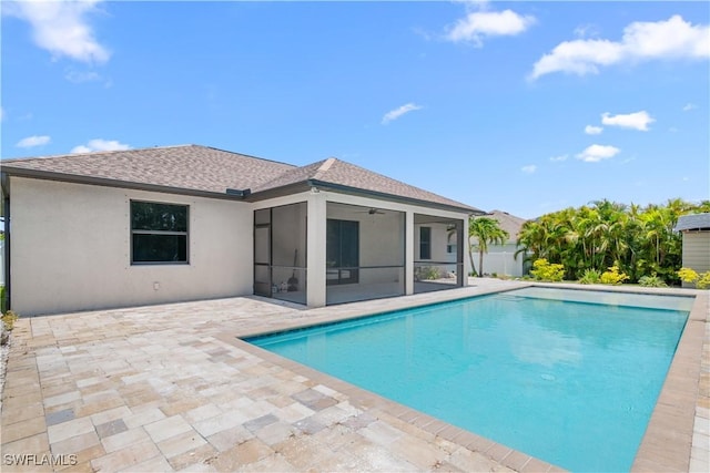2208 SW 12th Ln, Cape Coral, FL 33991 - view of swimming pool featuring a ceiling fan, a patio area, and a sunroom