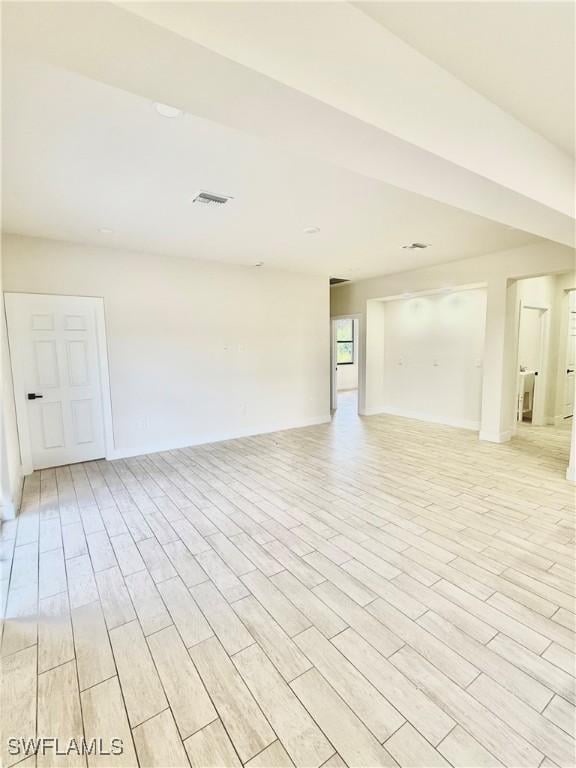 3411 74th St W, Lehigh Acres, FL 33971 - unfurnished room with light wood-style flooring and baseboards