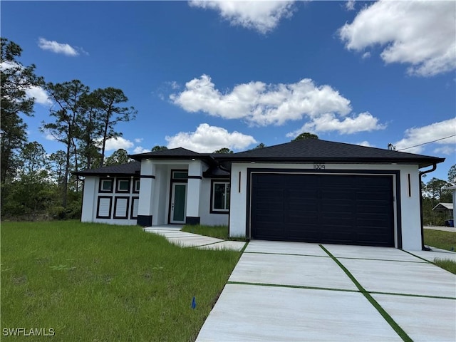 1010 Euclid Ave, Lehigh Acres, FL 33972 - prairie-style house featuring stucco siding, an attached garage, concrete driveway, and a front lawn