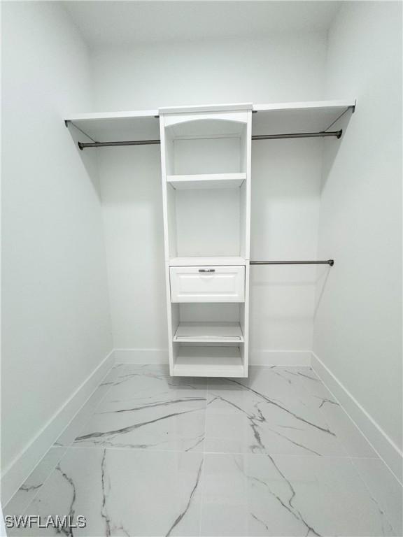 1010 Euclid Ave, Lehigh Acres, FL 33972 - spacious closet featuring marble finish flooring