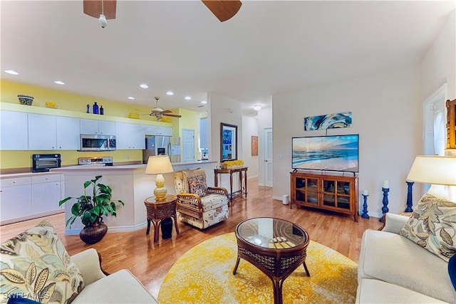 19977 Lake Vista Cir Unit 17A, Lehigh Acres, FL 33936 - living room with a ceiling fan, light wood finished floors, recessed lighting, and baseboards