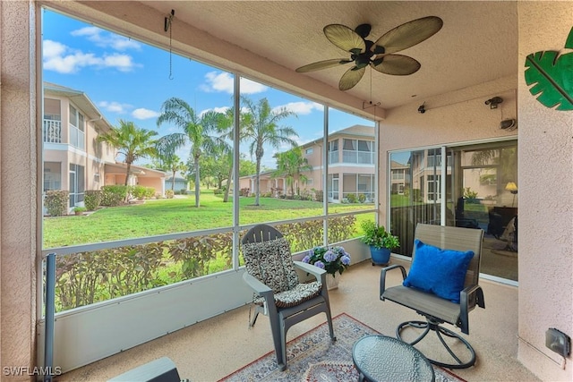 19977 Lake Vista Cir Unit 17A, Lehigh Acres, FL 33936 - sunroom / solarium with a ceiling fan and a residential view