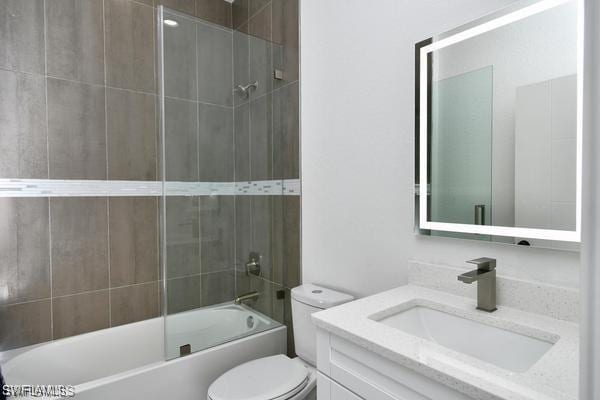 8304 Lena Ct, Labelle, FL 33935 - full bathroom featuring toilet, combined bath / shower with glass door, and vanity