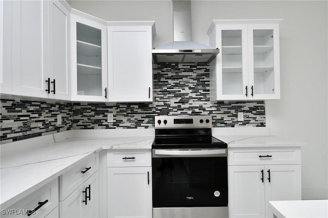7071 Tide Cir, Labelle, FL 33935 - kitchen with stainless steel electric range oven, wall chimney exhaust hood, and white cabinetry