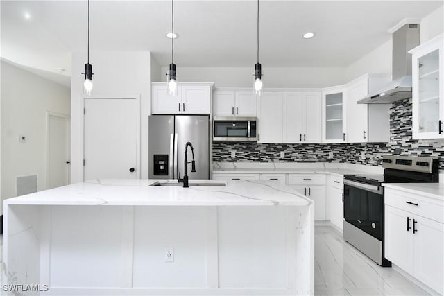 7071 Tide Cir, Labelle, FL 33935 - kitchen with stainless steel appliances, wall chimney exhaust hood, a sink, light marble finish floors, and decorative backsplash