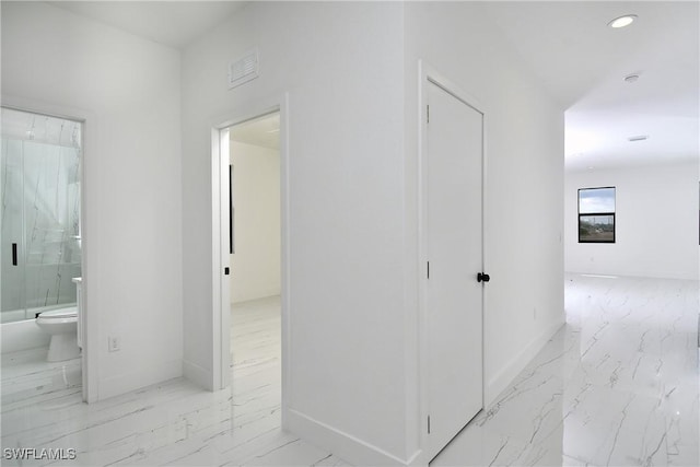 7071 Tide Cir, Labelle, FL 33935 - corridor featuring marble look tile flooring, baseboards, and recessed lighting