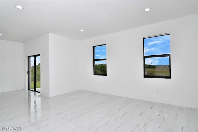 7071 Tide Cir, Labelle, FL 33935 - empty room featuring recessed lighting, baseboards, and light marble finish floors