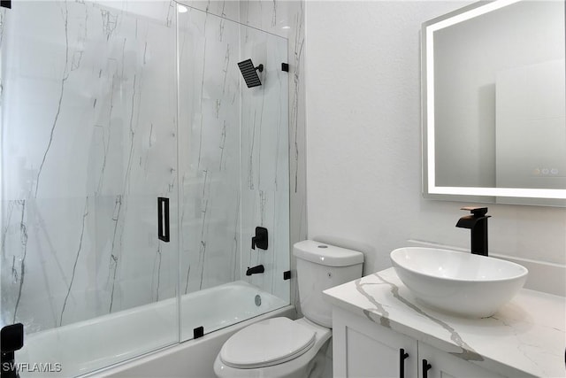 7071 Tide Cir, Labelle, FL 33935 - full bath with toilet, vanity, and enclosed tub / shower combo