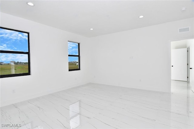 7071 Tide Cir, Labelle, FL 33935 - spare room featuring marble finish flooring, recessed lighting, and baseboards