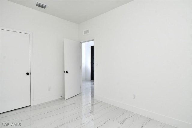 7071 Tide Cir, Labelle, FL 33935 - empty room with light marble finish floors and baseboards