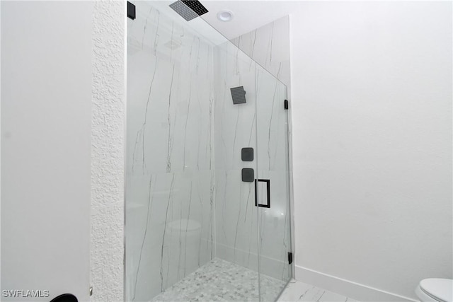 7071 Tide Cir, Labelle, FL 33935 - bathroom with a marble finish shower, toilet, and baseboards