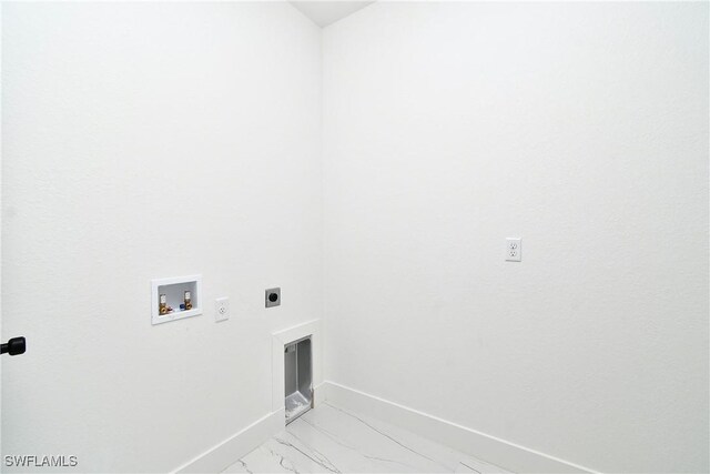 7071 Tide Cir, Labelle, FL 33935 - washroom featuring hookup for an electric dryer, washer hookup, baseboards, and light marble finish flooring