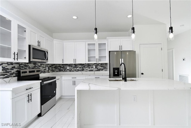 6010 Acorn Cir, Labelle, FL 33935 - kitchen featuring stainless steel appliances, a sink, light marble finish flooring, backsplash, and white cabinets