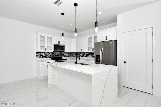 6010 Acorn Cir, Labelle, FL 33935 - kitchen with stainless steel appliances, a sink, light marble finish flooring, recessed lighting, and decorative backsplash
