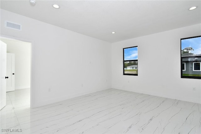 6010 Acorn Cir, Labelle, FL 33935 - unfurnished room featuring recessed lighting, light marble finish flooring, baseboards, and a smoke detector