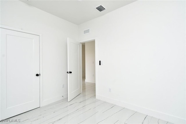 6010 Acorn Cir, Labelle, FL 33935 - unfurnished room with baseboards and light marble finish floors
