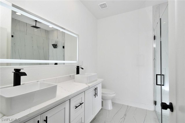 6010 Acorn Cir, Labelle, FL 33935 - full bathroom with a marble finish shower, marble finish floors, toilet, double vanity, and recessed lighting