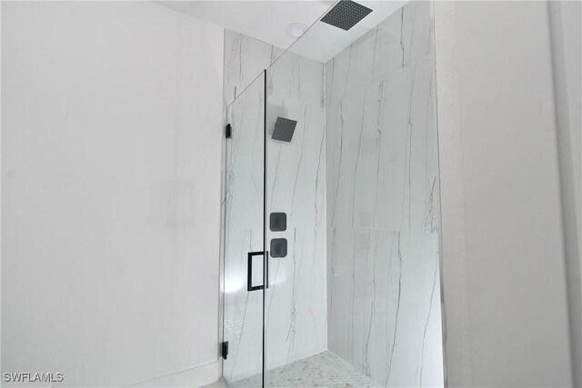 6010 Acorn Cir, Labelle, FL 33935 - bathroom featuring a marble finish shower
