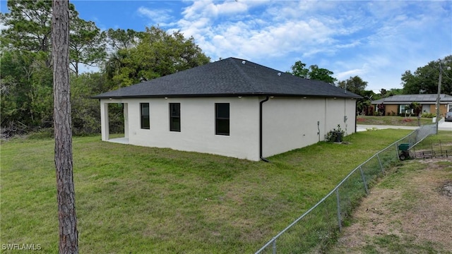6010 Acorn Cir, Labelle, FL 33935 - view of home's exterior with stucco siding and a shingled roof