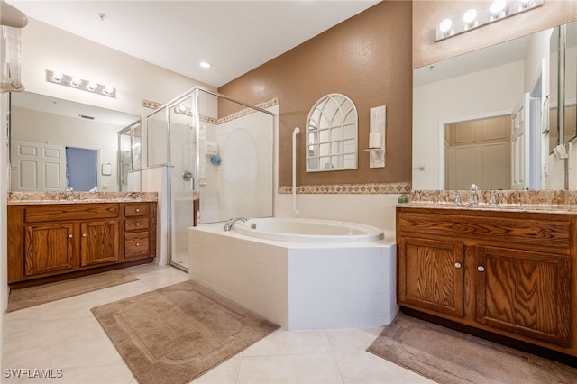 14746 Calusa Palms Dr Unit 102, Fort Myers, FL 33919 - bathroom featuring a shower stall, a bath, tile patterned floors, and two vanities