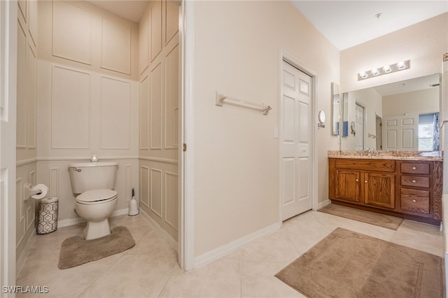 14746 Calusa Palms Dr Unit 102, Fort Myers, FL 33919 - bathroom featuring toilet, vanity, tile patterned flooring, and a closet