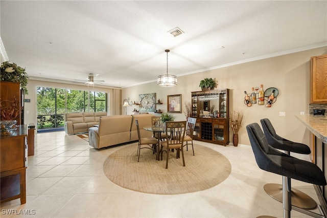 14746 Calusa Palms Dr Unit 102, Fort Myers, FL 33919 - dining space featuring crown molding and light tile patterned floors