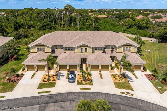 14746 Calusa Palms Dr Unit 102, Fort Myers, FL 33919 - view of front facade with concrete driveway and stucco siding