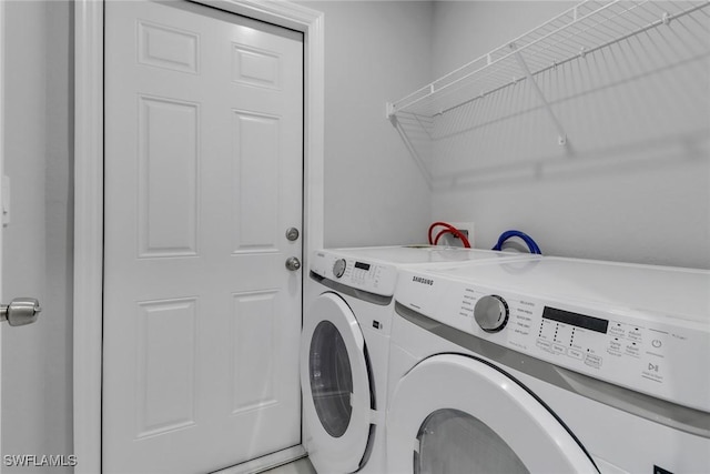 761 Fleming Ave S, Lehigh Acres, FL 33974 - laundry area featuring washing machine and clothes dryer
