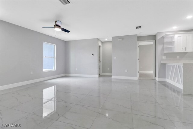 761 Fleming Ave S, Lehigh Acres, FL 33974 - unfurnished room with light marble finish flooring, baseboards, a ceiling fan, and recessed lighting
