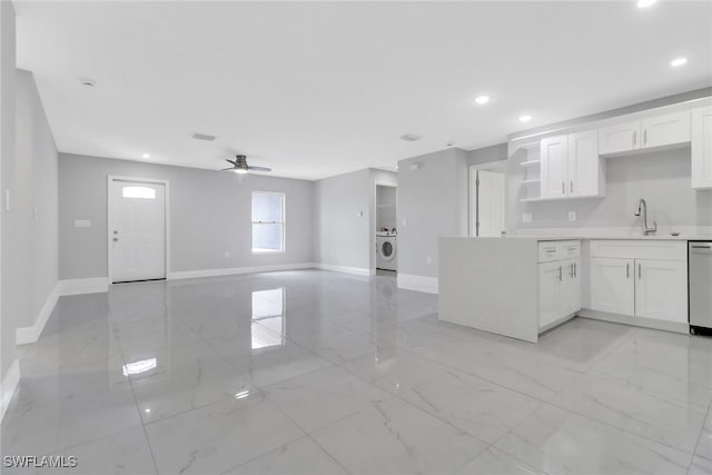 761 Fleming Ave S, Lehigh Acres, FL 33974 - kitchen featuring baseboards, open shelves, a sink, light marble finish flooring, and recessed lighting