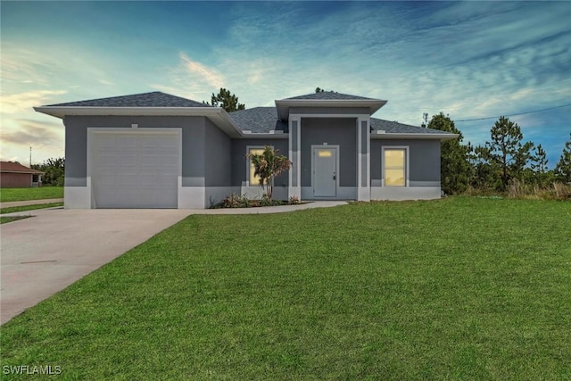 761 Fleming Ave S, Lehigh Acres, FL 33974 - prairie-style house with stucco siding, concrete driveway, an attached garage, a front lawn, and a shingled roof