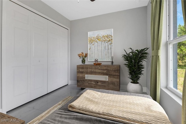 761 Fleming Ave S, Lehigh Acres, FL 33974 - bedroom featuring multiple windows and a closet