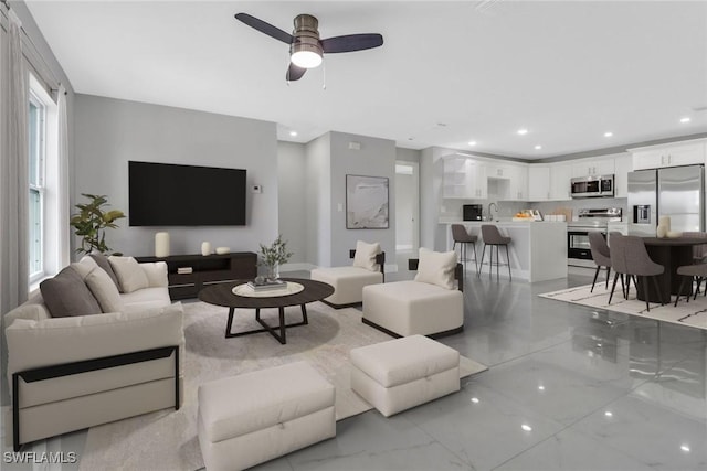 761 Fleming Ave S, Lehigh Acres, FL 33974 - living area with ceiling fan, light marble finish flooring, and recessed lighting