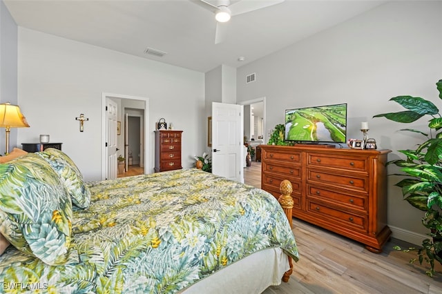 10016 Majestic Ave, Fort Myers, FL 33913 - bedroom with light wood-style flooring, a high ceiling, and ceiling fan