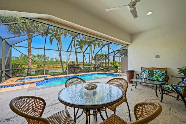 10016 Majestic Ave, Fort Myers, FL 33913 - swimming pool with a patio area, an in-ground hot tub, ceiling fan, a water view, and glass enclosure